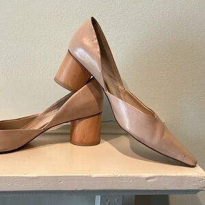 Elegant bone pump with 2 inch round block heel.